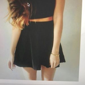 Pleated black mini skirt